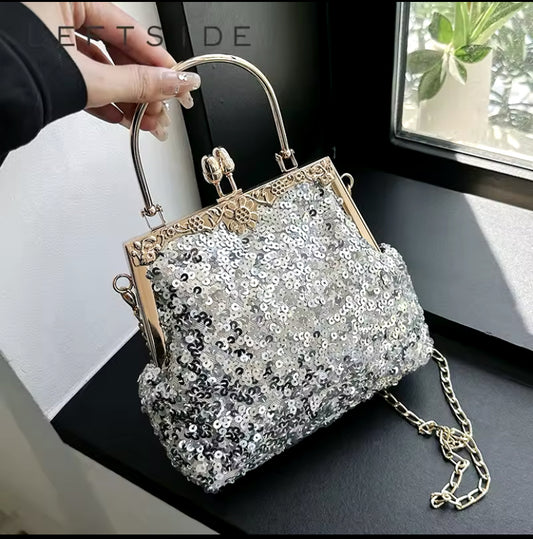Bolso de fiesta resplandor para tonos plateados y dorados ,mango y cadena para colgar