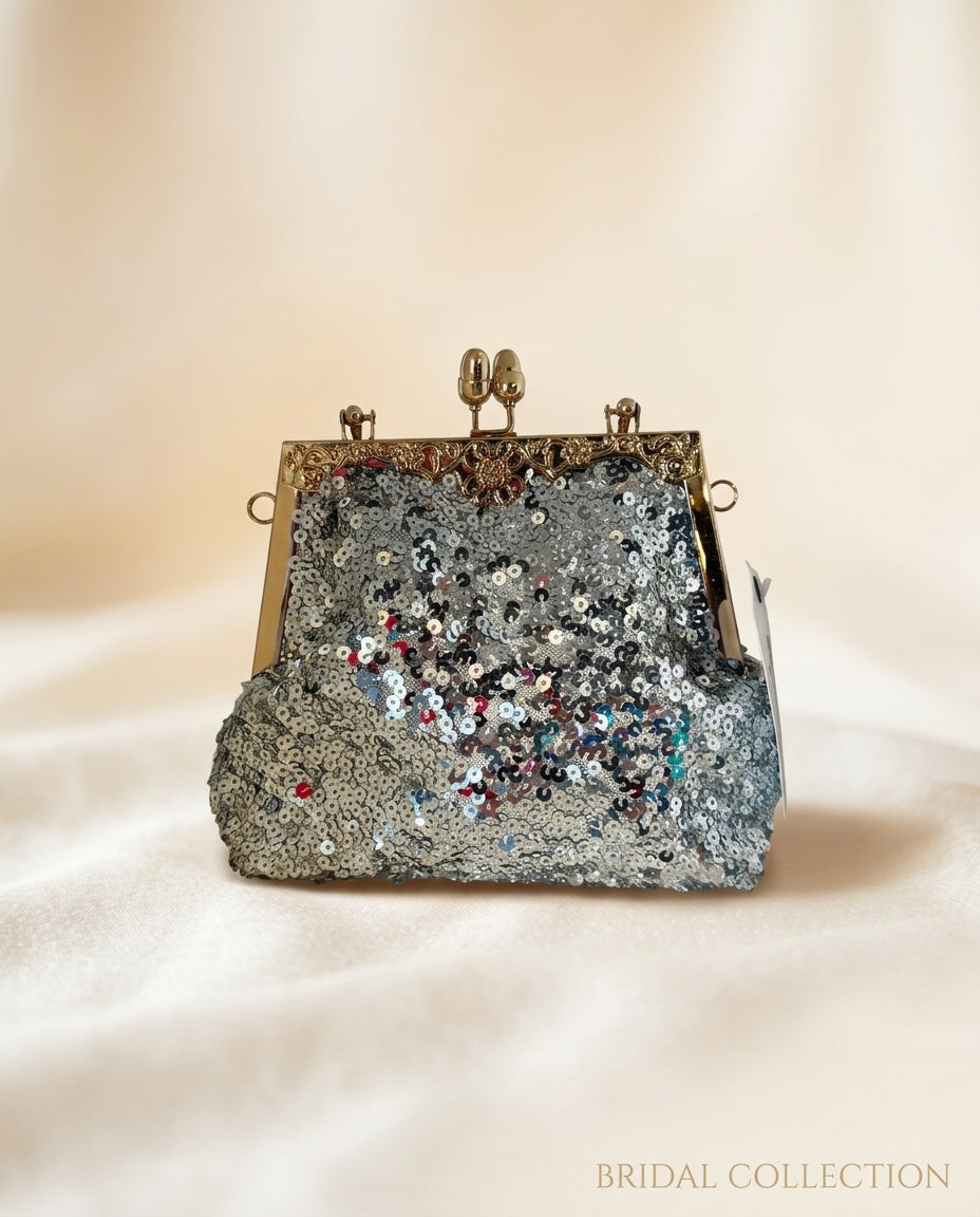 Bolso de fiesta resplandor para tonos plateados y dorados ,mango y cadena para colgar