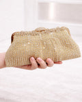 Clutch de fiesta Luxor dorado pedrería y cadena para colgar