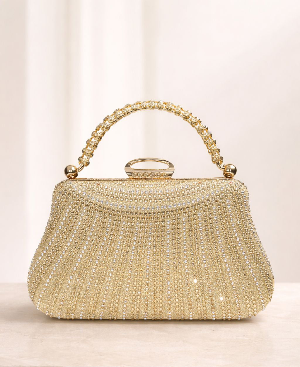 Bolso de fiesta New york con manilla y brillos en dorado champagne