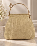 Bolso de fiesta Minerva en tonos dorados, mango curvo y cadena para colgar