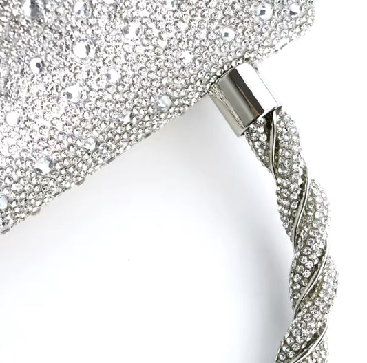 Bolso de fiesta plate star en tonos plateados y aplicaciones brillantes con mango y cadena para colgar