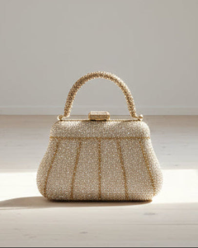 Bolso de fiesta New york con manilla y brillos en dorado champagne